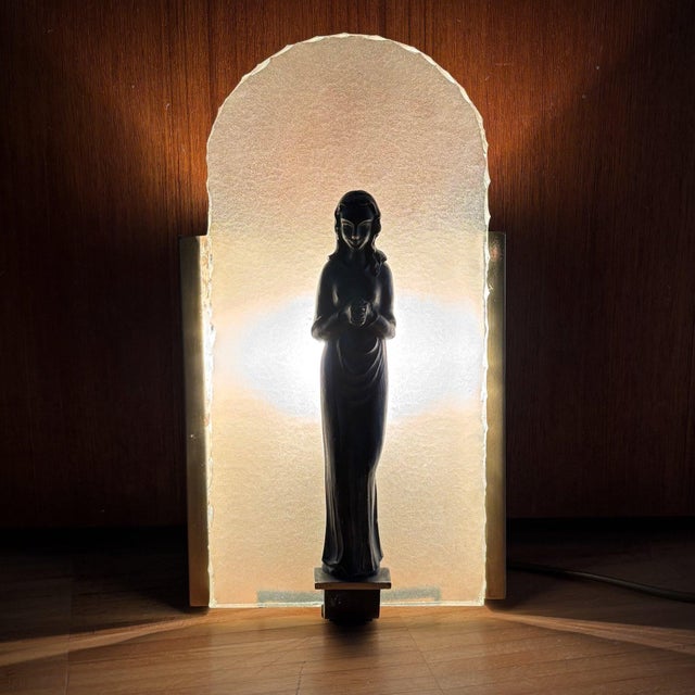 Swedish Modern wall lamp with a distinctly devotional character, produced in Sweden during the 1930s. The lamp features a...