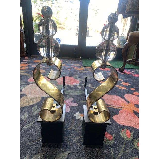 Elevate your hearth with a spectacular infusion of machine-age glamour and sculptural sophistication. This striking pair...