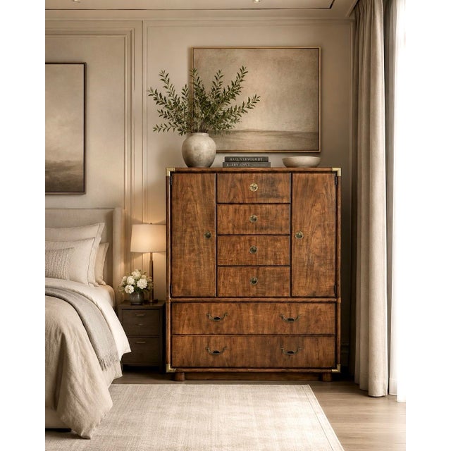 A wonderful campaign tallboy from the Drexel Accolade range. Beautiful wood grain contrasts splendidly with the gleaming...