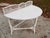 Vintage white wicker table functions well as a sideboard, sitting room or porch furniture. The wicker is in very good...