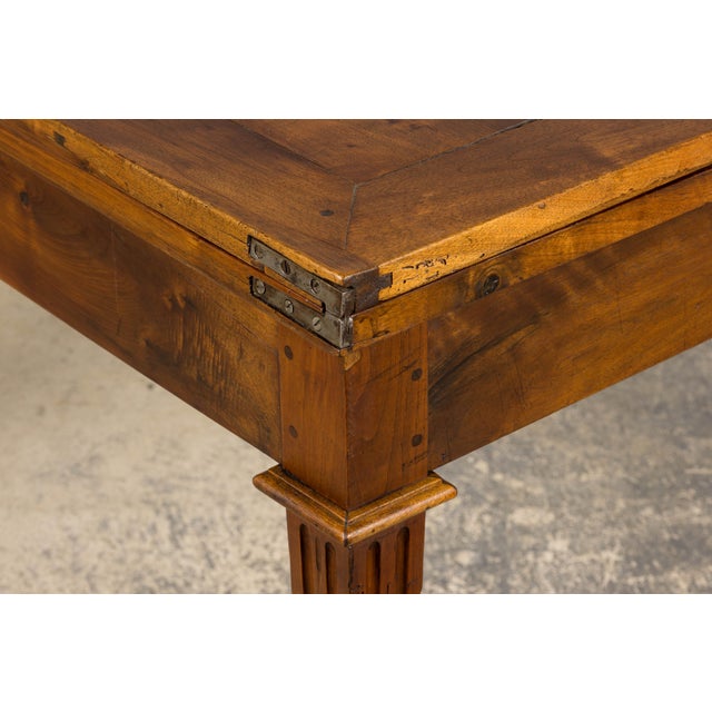 Mid-19th century French extendable dining table in the Neoclassical Louis XVI style, sourced from Provence, France. Hand-...