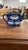A charming vintage blue and white ceramic teapot featuring a bamboo-molded texture along the body, handle, and spout....