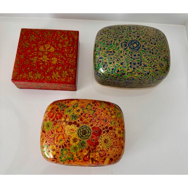 Gorgeous set of three Kashmir handmade Papier Mache boxes decorated with Persian floral patterns.