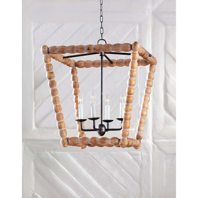 The Perennial birch wood lantern features a beautifully hand-carved outer frame that forms an open-air silhouette. An...