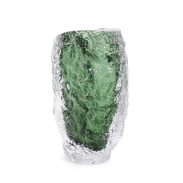 Featuring a sleek design and bright green tones, this piece stands out with its fluid, sculpted shape, making it a...
