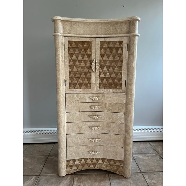 A single vintage large floor standing jewelry cabinet featuring a tessellated marble and natural stone finish on all...