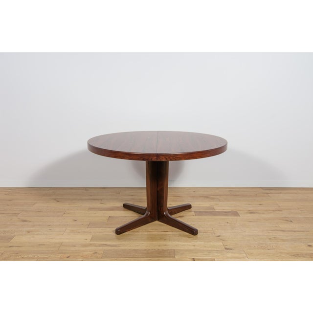 Round extendable table made of rosewood wood, manufactured in Denmark in the 1960s. The table is characterized by...