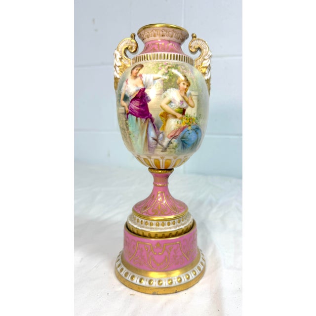 This rare antique 19th century hand painted Royal Vienna porcelain urn is a stunning collectible piece featuring intricate...