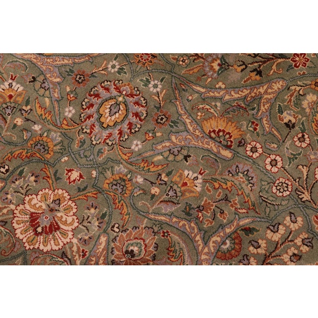 Designed with mesmerizing intricacy and gorgeous color palette, this hand-knotted masterpiece demonstrates the beauty and...