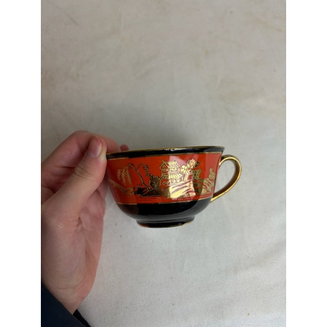 These burnt orange tea cups and tea plates are hand painted from the brand Noritake, made in Japan. They have black and...