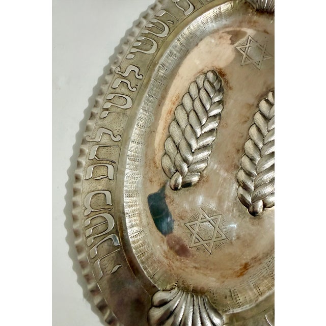 A LARGE SILVER CHALLAH TRAY Germany c. 1890. Crimped border. Chased with biblical passage with commandment to “Remember...