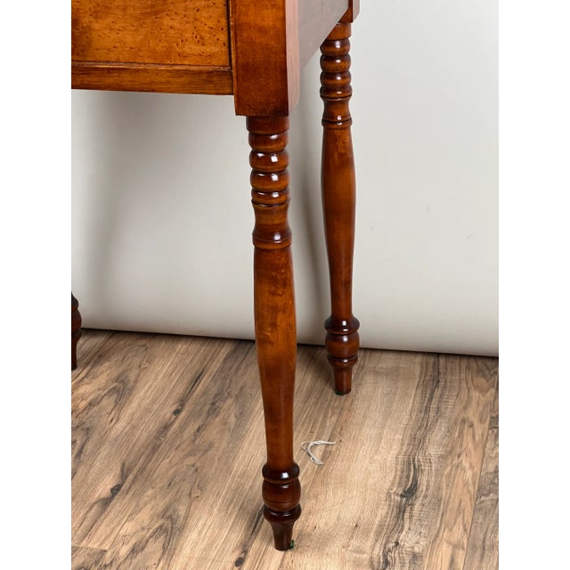 This antique American Sheraton one drawer stand, dating to the mid-19th century, is crafted of beautiful birdseye maple...