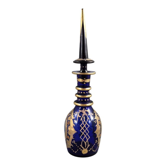A striking antique Bohemian cobalt glass decanter dating from the late nineteenth century and created for the luxury Qajar...