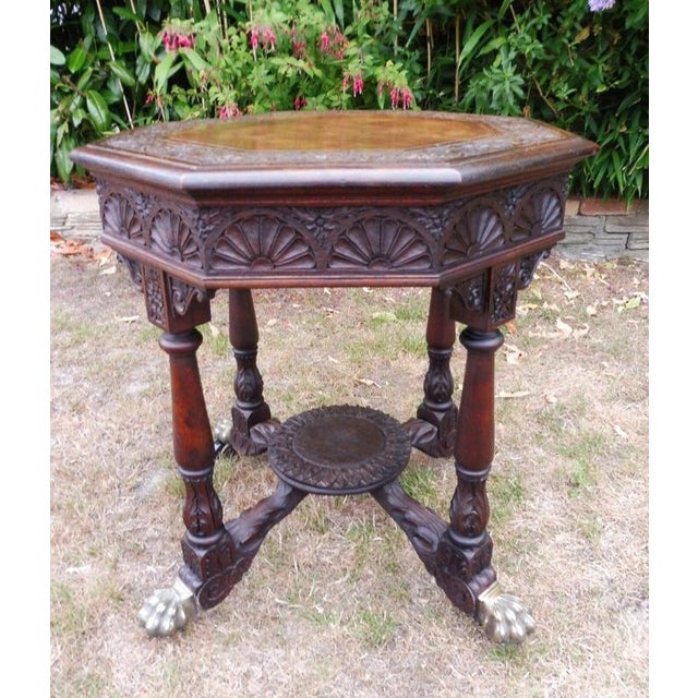 Regency Carved Country Oak Occasional Table, circa 1800–1820 Material: Country oak and brass A superb English country oak...