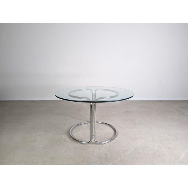 We are offering a beautiful Space Age vintage glass table from the 1980s for sale. The tabletop has a small damage to the...