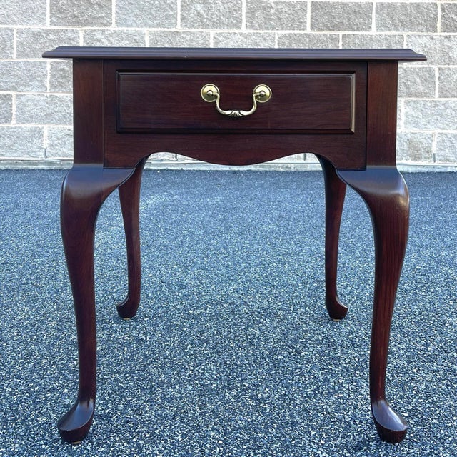 An early 21st century Ethan Allen Georgian Court collection Traditional Queen Anne style solid cherry side or end table...