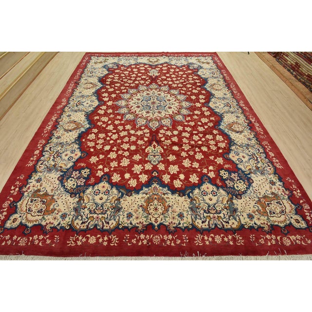 An authentic vintage traditional Kashan rug hand-knotted with fine wool and natural dyes. This oriental rug features a...