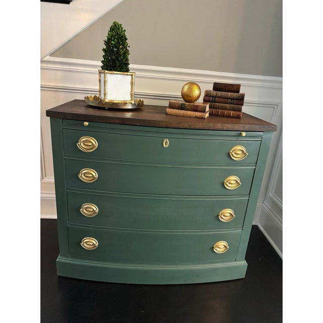 Offered is a vintage Hepplewhite style chest of drawers. This piece features four dovetailed, smooth gliding drawers, pull...