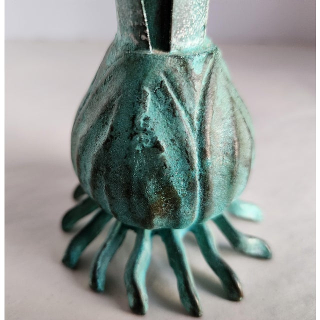 The Carnevale brass Verdigris Italian bud vase is a simple, organic vessel with an elegance of linear design. The lifelike...