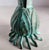 The Carnevale brass Verdigris Italian bud vase is a simple, organic vessel with an elegance of linear design. The lifelike...