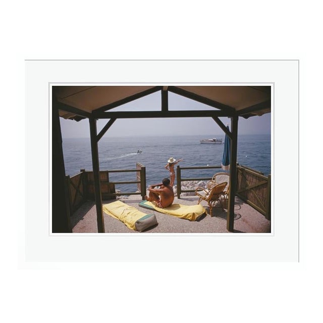 Beach Hut in Antibes 1969 by Slim Aarons Framed C Print For Sale