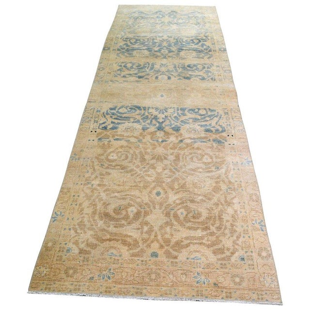 Hand-knotted with care using traditional rug-making techniques, this wool rug blends timeless craftsmanship with a modern...