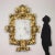 Baroque mirror, the frame is carved with mighty leafy volutes, it is entirely gilded; with losses and restorations. Please...