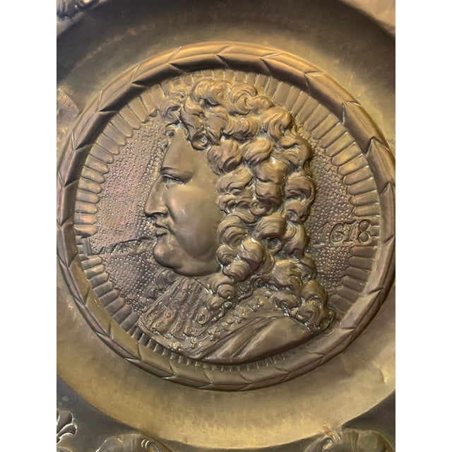 Unique 19thC oversized French brass repousse Louis XIV platter with royal fleur de lys, fruit baskets and cherub motifs. A...