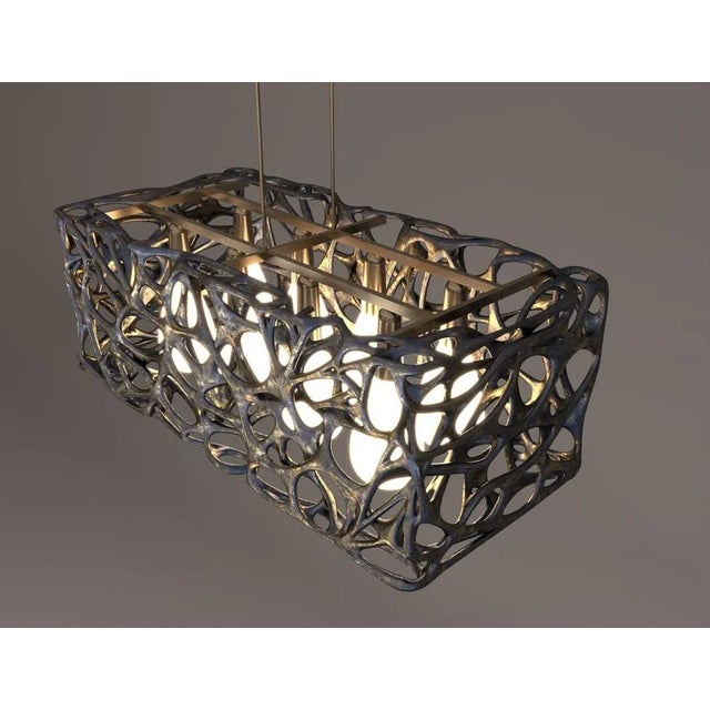 Morphogen pendant lamp by john brevard dimensions: d 50.8 x w 106.68 x h 50.8 cm materials: bronze derived from the greek...