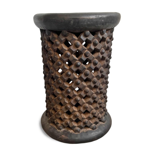 Authentic vintage hand carved Bamileke tribal tall wood stool. Masterfully crafted from one piece of indigenous wood....