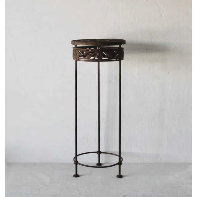 Fabulous vintage plant stand with lots of patina. Ornate with repeated leaf pattern. In good vintage condition with patina...