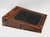 A large flame mahogany writing slope c.1860 with brass binding, attractive lock escutcheon and blank cartouche. The box is...