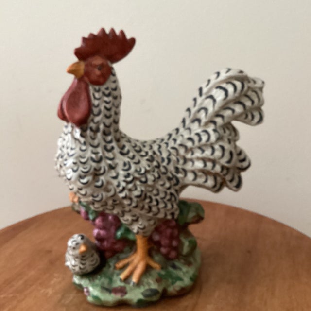 This vintage authentic Italian hand-painted ceramic rooster and tiny hen sculpture are figurines made of porcelain....