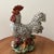 This vintage authentic Italian hand-painted ceramic rooster and tiny hen sculpture are figurines made of porcelain....