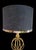 A wonderful pair of very tall gold iron sphere shaped table lamps with custom linen black brass trim shades. The lamps are...