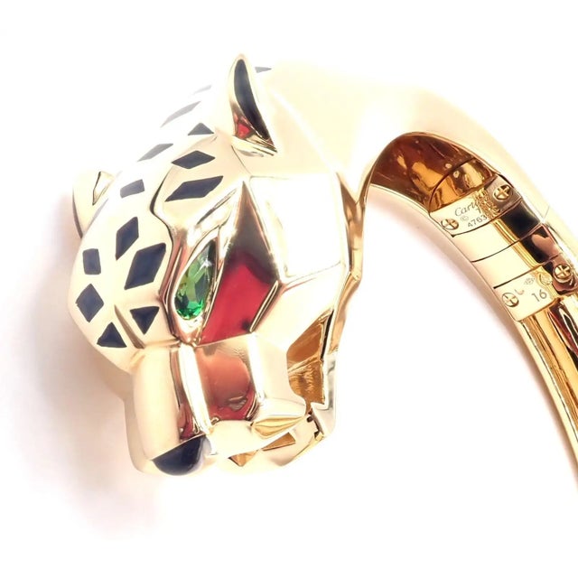 18k Yellow Gold Panther Panthere Tavorite Onyx Size 16 Panther Bangle Bracelet by Cartier. ***This bracelet comes with...