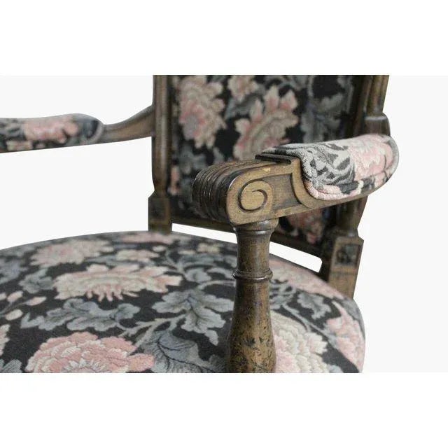 Pair of French armchairs with floral tapestry and walnut hand carved frames. Seat height measures 18 inches