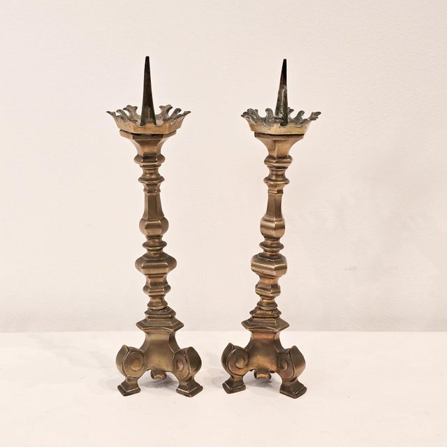 A pair of Gothic-style candlesticks, England, 19th century.