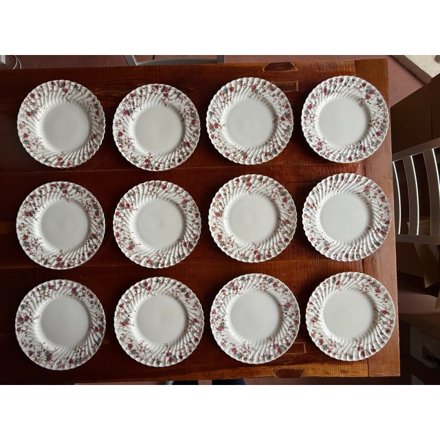 Step back in time to an era of unparalleled elegance with this immaculate 102-piece set of Minton fine bone china in the...