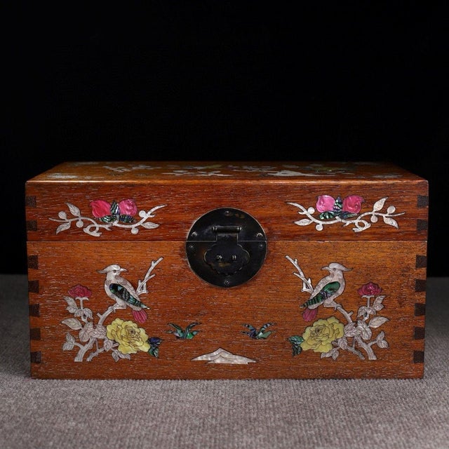 A beautifully crafted Chinese rectangular box, likely made of Huali (rosewood). The box features a hinged lid with brass...