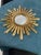 Large 60cm sunburst mirror, known as a witch's eye, vintage French, 1960s. Entirely made of gold-painted resin with a 20cm...