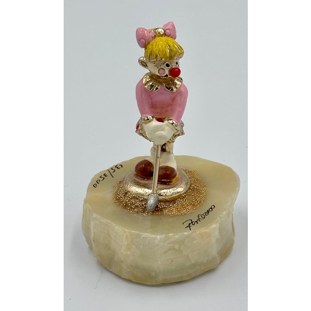 Discover this exquisite Ron Lee Collectors Club figurine, a delightful piece featuring a female lady golfer # 135/3500....