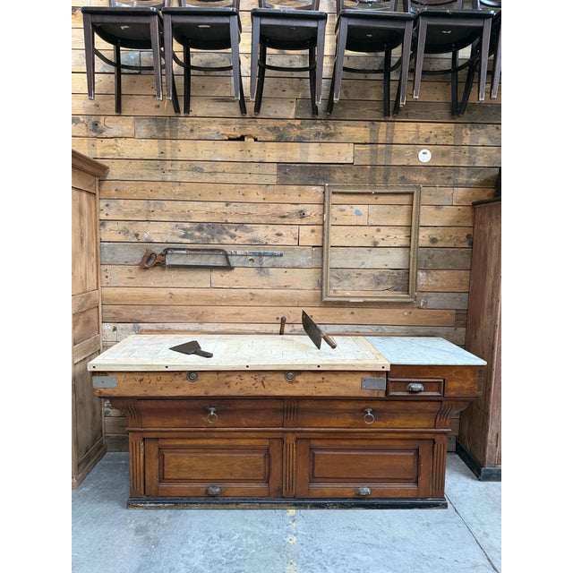 This magnificent antique butcher block has been fully restored. It features a top composed of two-thirds end‑grain wood...