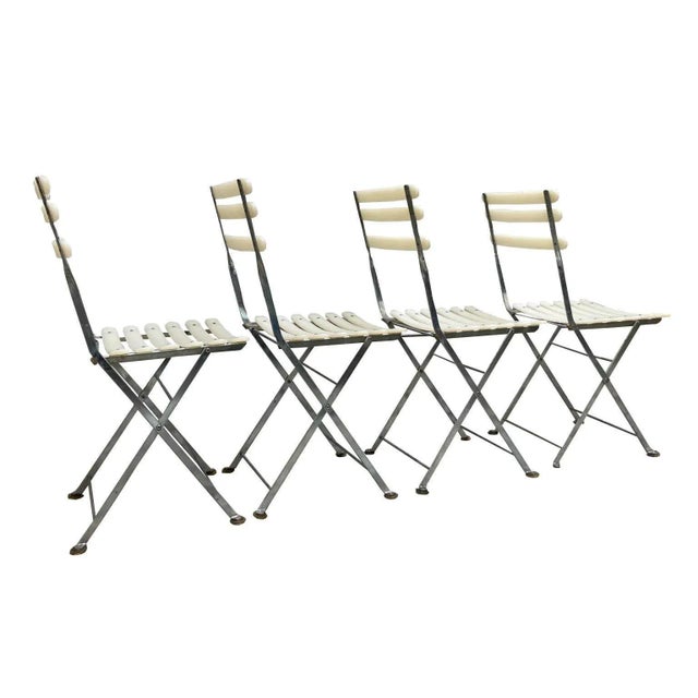 Group of 4 folding chairs suitable for home balconies or large green gardens. This piece has an attribution mark, I am...