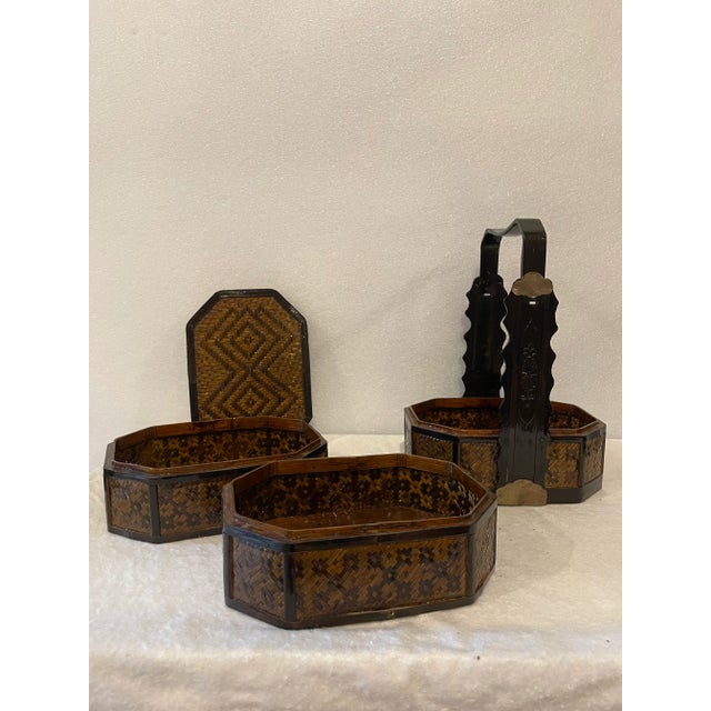 Vintage oriental Chinese woven canes box, 3 compartments. Black lacquer handle with decorative brass mounts.