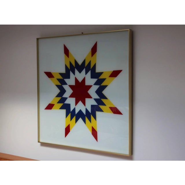 1970s modern Op Art on glass, with brass frame, in vintage original condition with some wear and patina due to age and use.