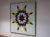 1970s modern Op Art on glass, with brass frame, in vintage original condition with some wear and patina due to age and use.