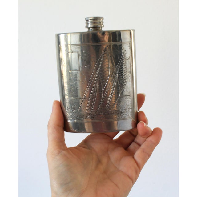 Vintage English pewter nautical themed ship hip flask. Makers mark on bottom. Two small dents. Pictured.