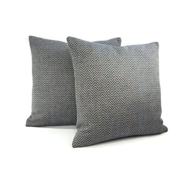 From Schumacher is Orwell in the color Lapis pillow cover. This pillow features blue chenille threads and gray threads...