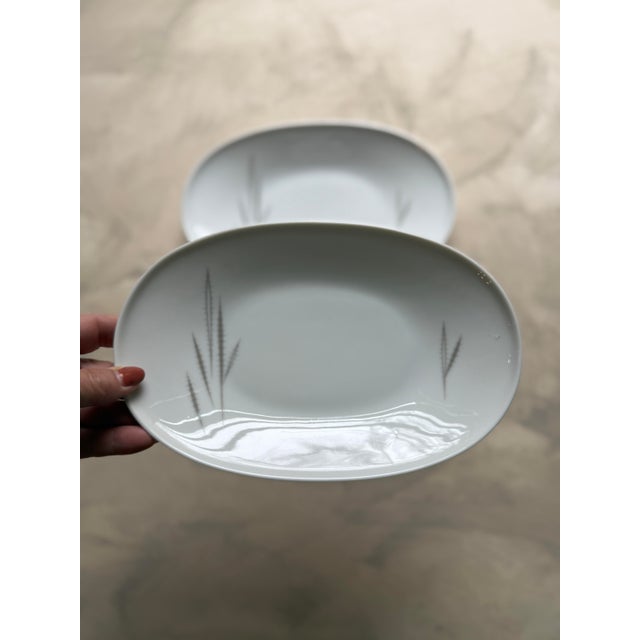 Serve in timeless mid-century style with this elegant pair of oval serving dishes from Heinrich & Co. (H&C) of Selb,...
